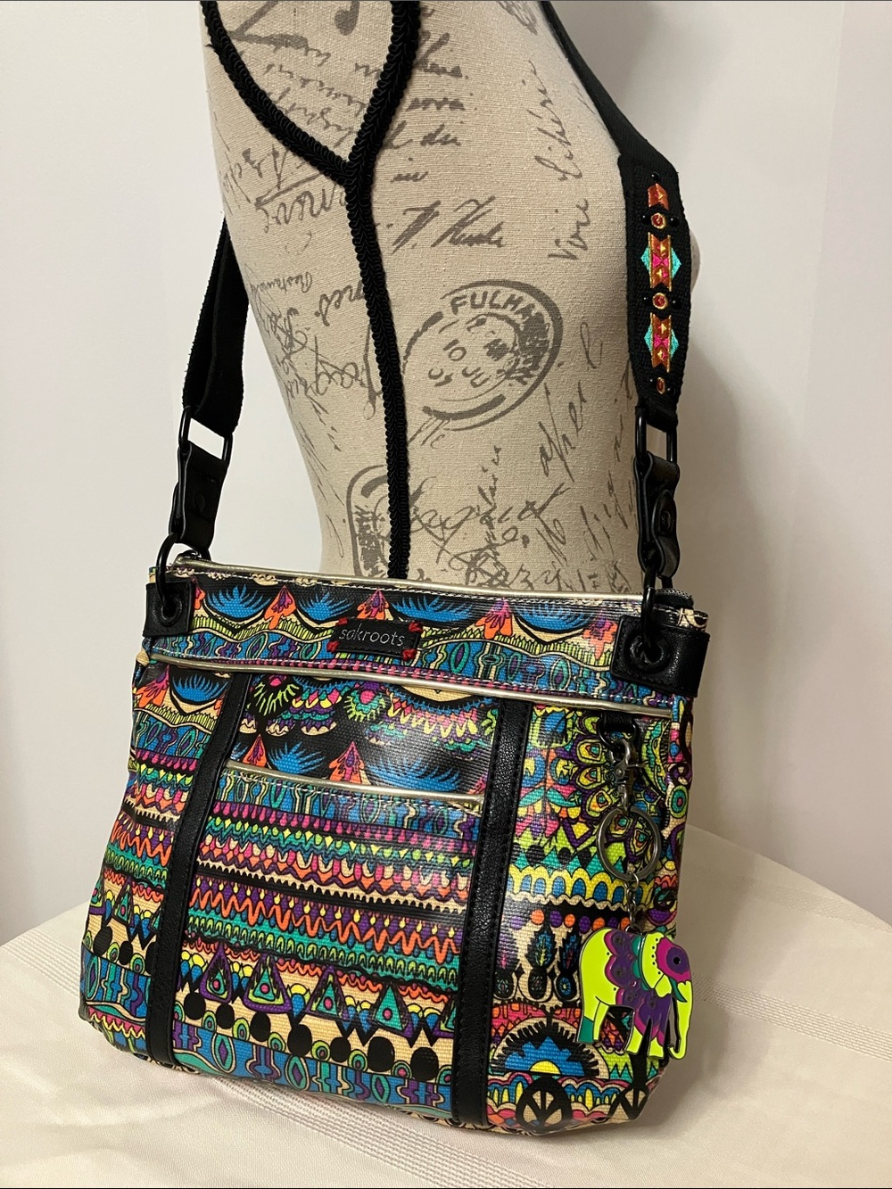 Sakroots Artist Circle Crossbody Bag in One World Black Neon Multi
